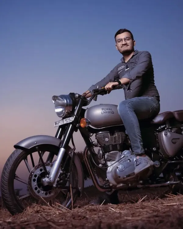 A pre-wedding portrait session with a Royal Enfield during the golden hour. These shoots are a great way to capture your personality in a relaxed, outdoor setting before the main events.