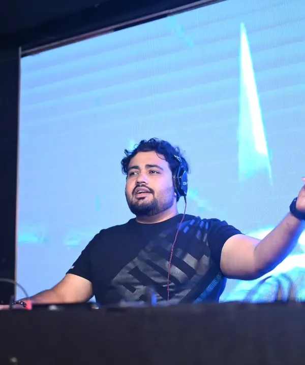 A clear shot of me in action behind the decks. This is where I feel most alive, connecting with the crowd through music.