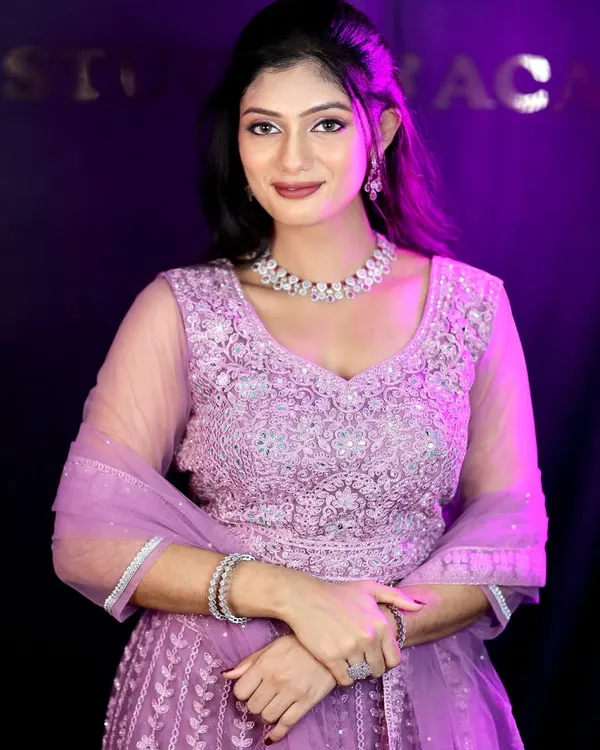A stunning party look in a lavender lehenga. The makeup is glamorous with defined eyes and a beautiful lip color, perfect for an evening reception or sangeet.