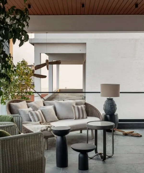 The deck area of the Aikaa show villa, which spills out from the home theatre. It's a perfect example of creating a fluid connection between indoor entertainment and outdoor relaxation.