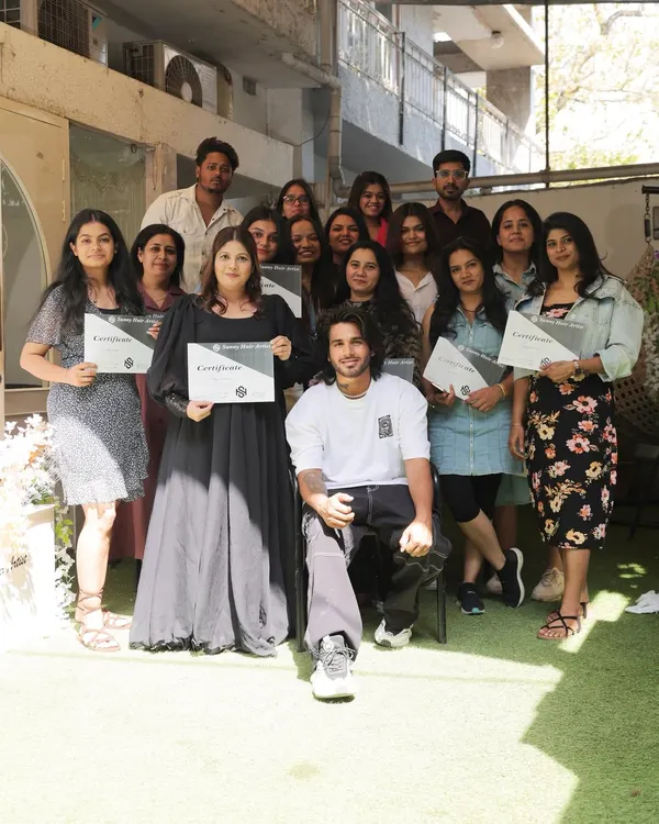 A proud moment with my students at the end of a successful masterclass. Each artist here has put in the work to master advanced hairstyling techniques.