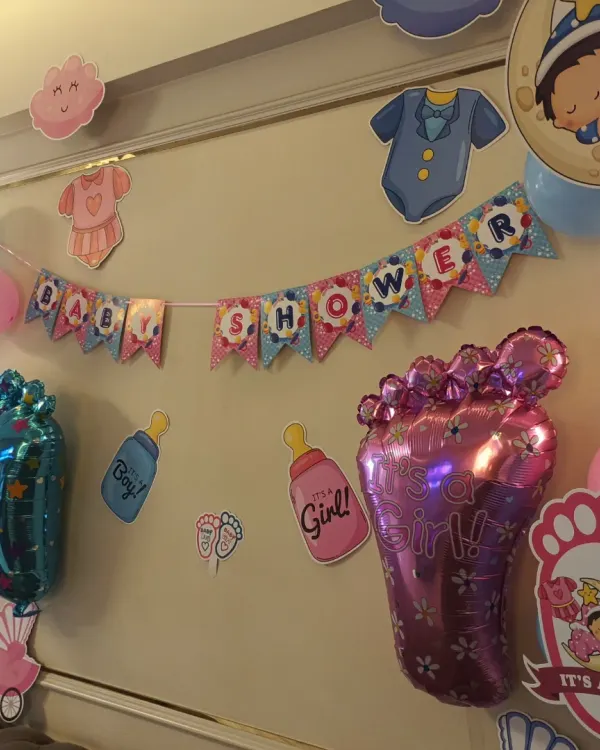 A charming baby shower decoration we did for a client in Belapur. The setup includes a "Baby Shower" banner, themed cutouts, and foil balloons for "It's a Boy!" and "It's a Girl!".