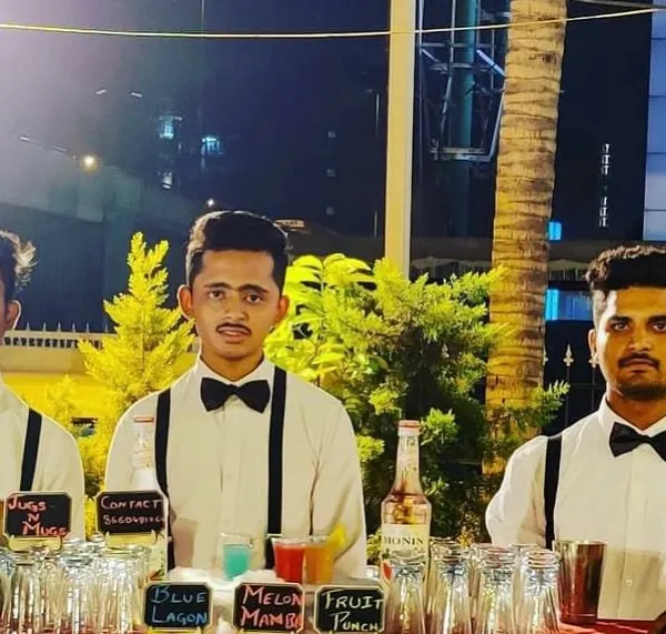 Our team of bartenders, looking sharp and ready to serve. Dressed in classic white shirts, bow ties, and suspenders, they bring a professional and stylish presence to any event.