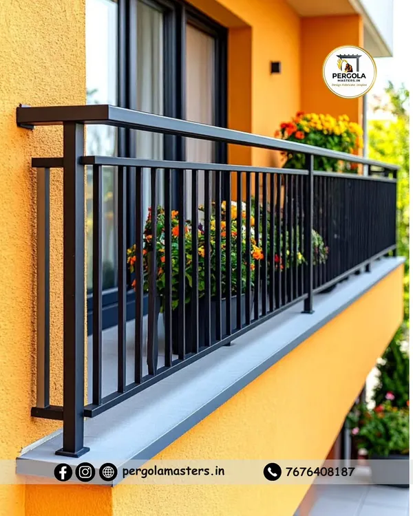 A classic and sturdy black metal railing with vertical balusters installed on a brightly colored balcony. The simple, clean design provides essential safety while complementing the building's cheerful exterior.