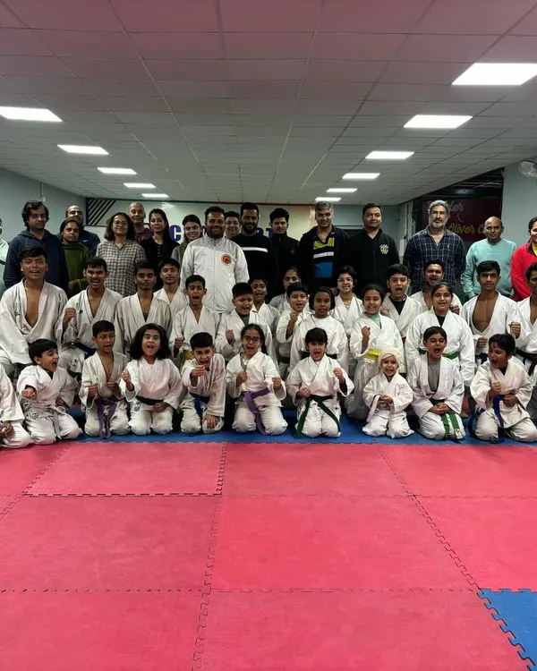 A group photo with students and their parents after a successful belt grading exam at our Noida branch. It is a proud day for the entire academy family.