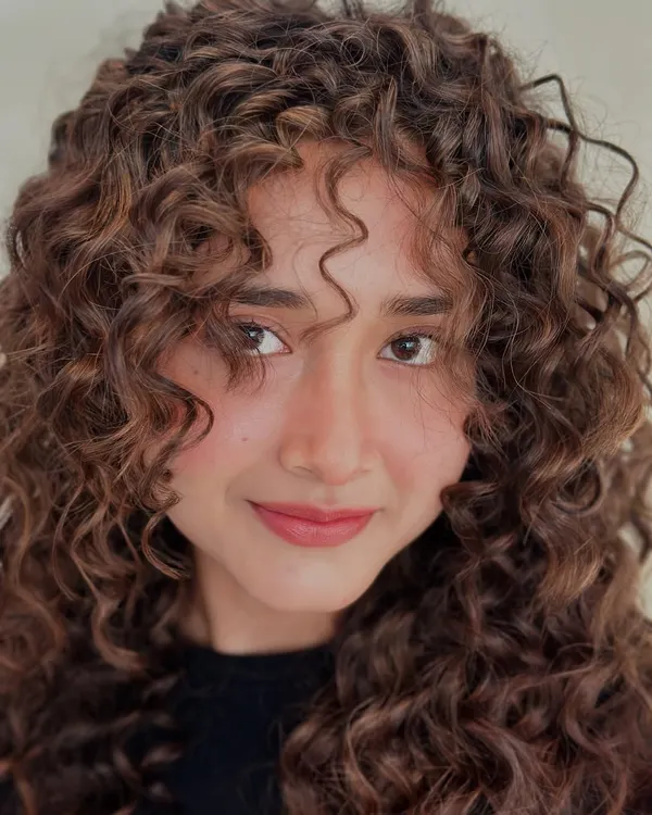 A close-up on these perfectly defined curls. My goal is to create a shape that allows each curl to sit beautifully without being weighed down.