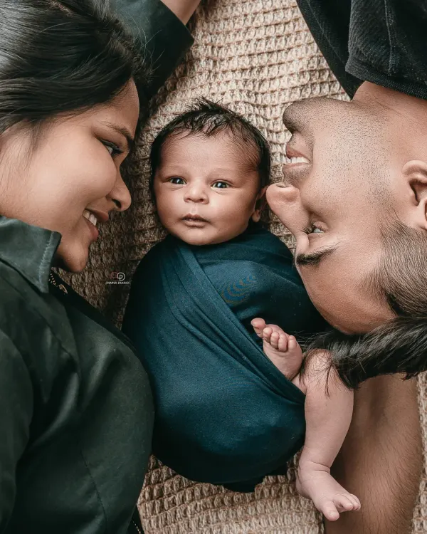 This is what it's all about. That first moment you see your new world reflected in your baby's eyes, captured in a timeless family portrait.