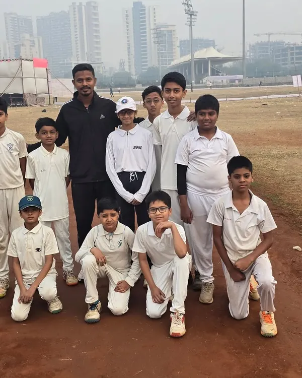 Our young cricketers with their coach, a snapshot of the bond we share as a team.