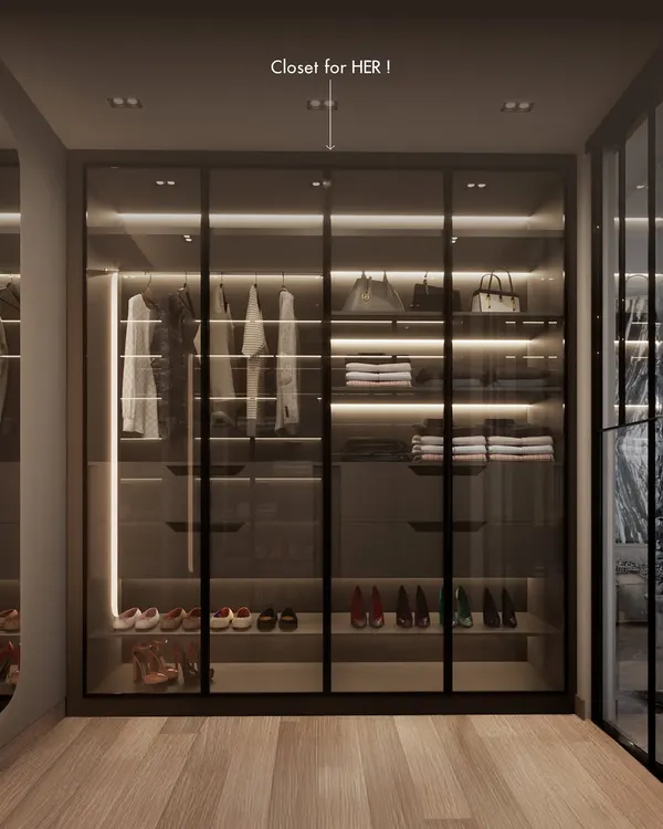 A closet designed for her. This section of the bespoke His & Hers walk-in closet features dedicated display space for handbags, adjustable shoe shelves, and ample hanging room, all illuminated by integrated LED lighting.