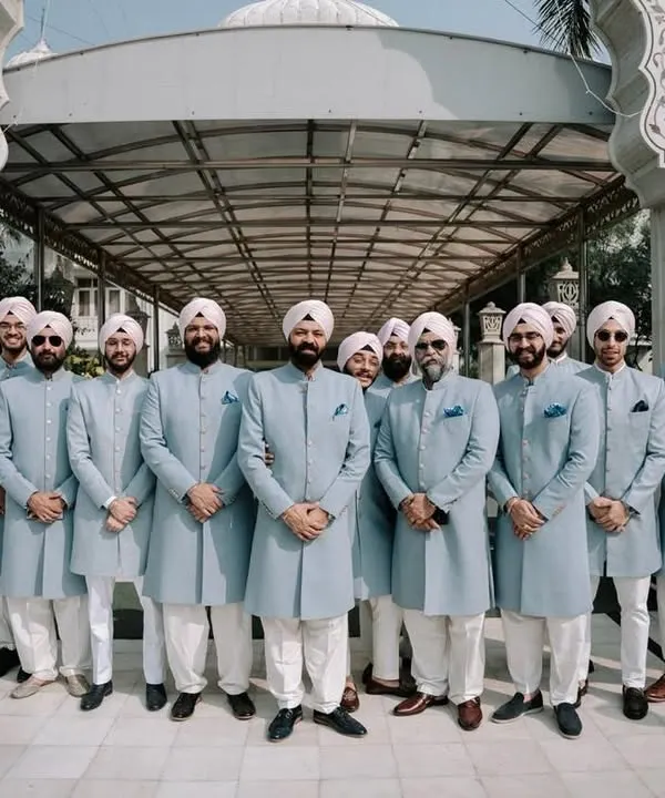 A powerful vision of brotherhood, with the groom and his party in perfectly coordinated light blue sherwanis. We ensure every member of your crew complements your look while maintaining their individual fit.
