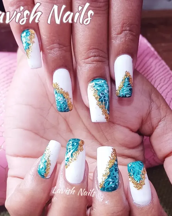 An intricate design inspired by Moroccan tiles, featuring a teal and white pattern with gold foil accents on square nails.