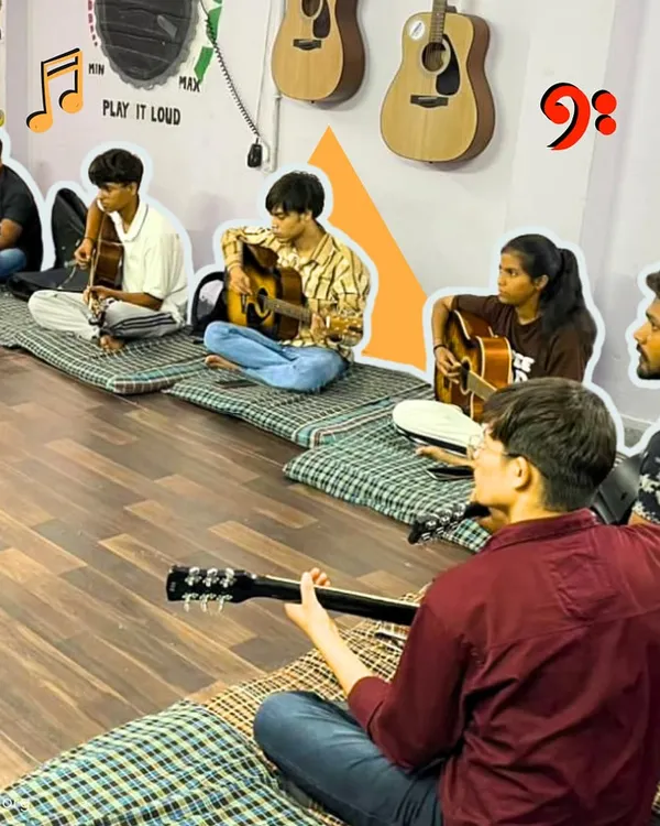 Our after-school guitar class in session. Students sit in a circle, learning from our instructor and each other. This collaborative environment is key to building both skills and friendships.