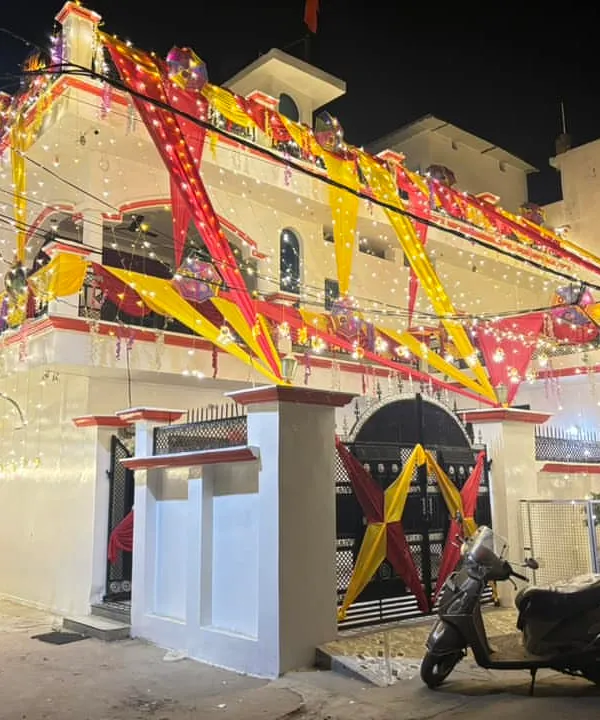 This is the 'shaadi wala ghar' look that I am known for. I can transform the entire exterior of your house with lights and colourful fabric draping to create a festive and welcoming atmosphere for your wedding celebrations.