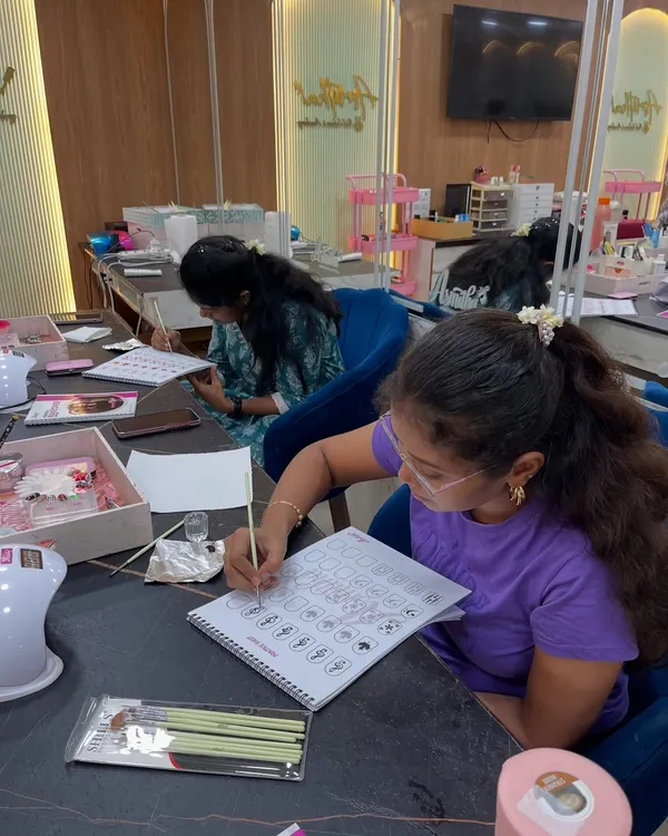 A glimpse into our acrylic and drill session. Students start by practicing designs on paper to understand the fundamentals of nail art.