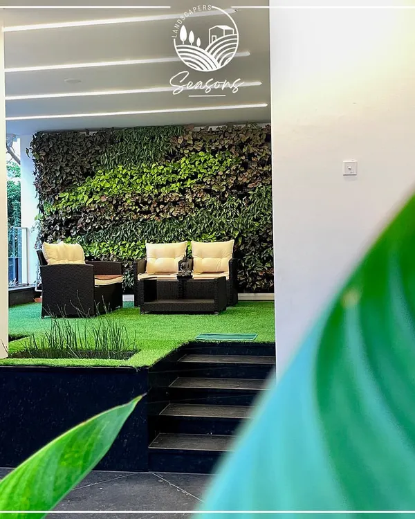 This is what we mean by bringing the outside in. We designed this serene seating area with a lush vertical garden and soft turf, creating a private oasis perfect for quiet moments and peaceful conversations. It’s a living room that truly breathes.