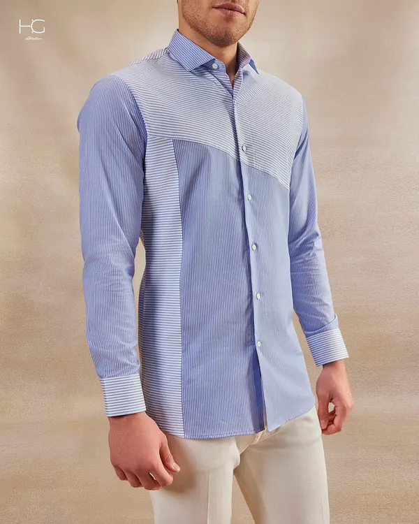 From boardrooms to soirées, this shirt speaks pure class. The unique paneling of striped fabrics creates a modern, sophisticated look that is both versatile and memorable.