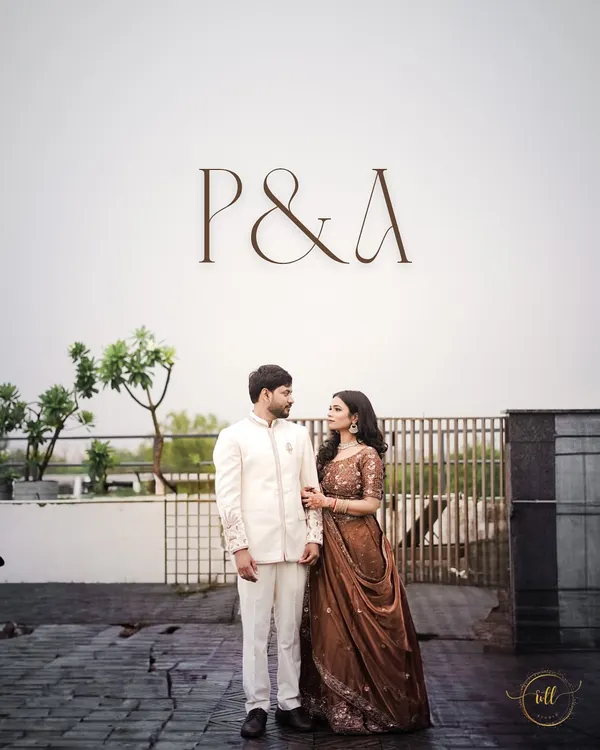 Piyush and Anjali stand together under their custom monogram at the Lemon Tree Hotel in Agra. This shot showcases a personalized detail of their engagement event.