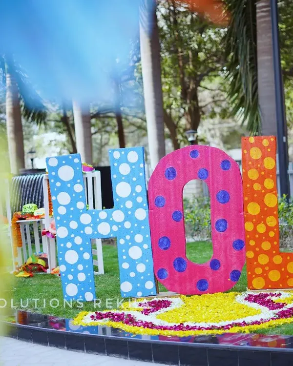 A vibrant and playful HOLI photo installation. I used large, colorful letters and a rangoli made of flower petals to create a fun and festive spot for guests to take pictures.