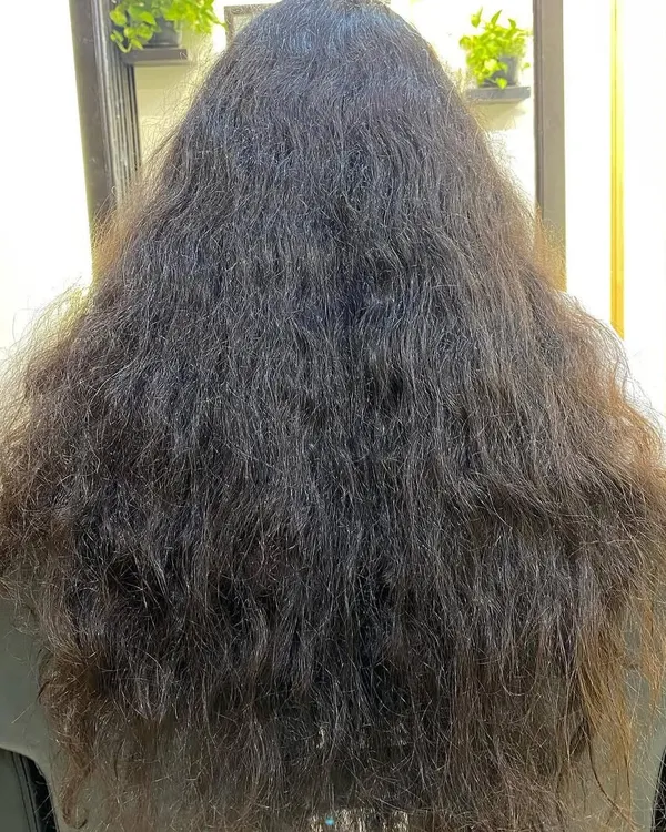 This is a common starting point for many of my clients: hair that feels dry, undefined, and frizzy. It's not a "mess," it's just misunderstood and waiting for the right care.