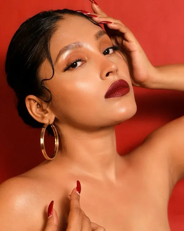 Channeling old Hollywood glamour with a modern twist. This look is all about the classic, bold red lip, flawless skin, and the iconic finger waves. It's a timeless statement of confidence.
