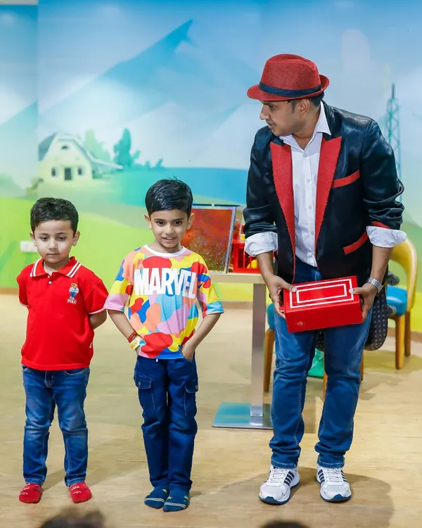 Our magician engaging young guests with an interactive trick. A magic show is a fantastic add-on to keep partygoers mesmerized.