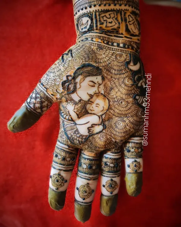 A detailed portrait capturing the tender moment between a mother and her newborn. This style of henna is a beautiful way to honor the journey of motherhood for your baby shower or Godh Bharai.