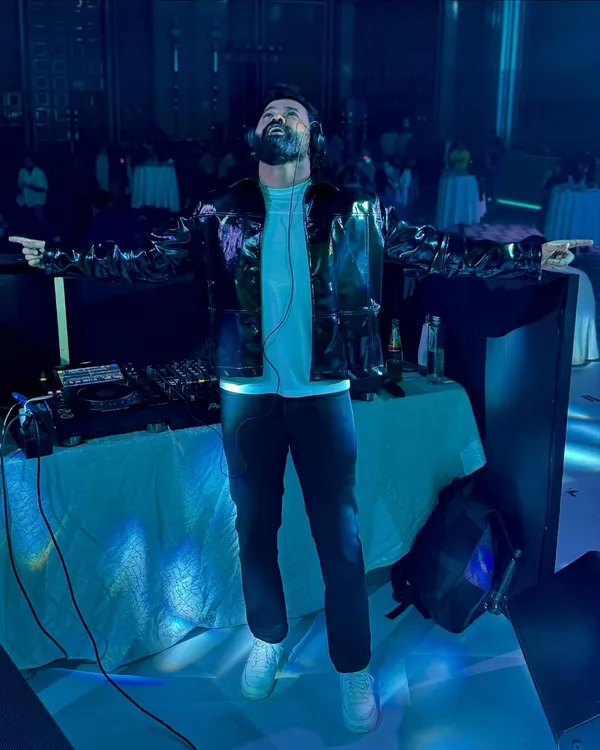 A candid shot capturing a moment of being completely lost in the music. This passion is what drives every set I play, ensuring your event gets 100% of my creative energy.