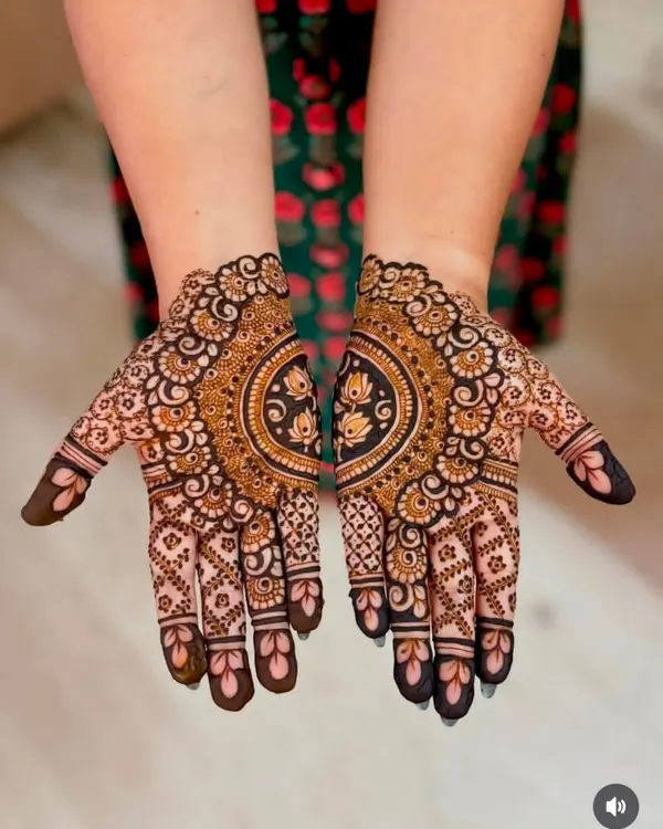 A beautiful and symmetrical mandala design on the palms, with lotus details. This style is very popular for festivals as it is elegant and not as heavy as bridal mehandi.