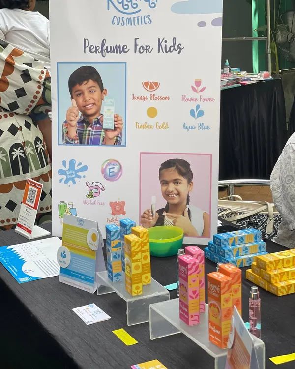 I love finding unique products like this kid-friendly perfume. This vendor's display shows the different scents available, all specially formulated for children.