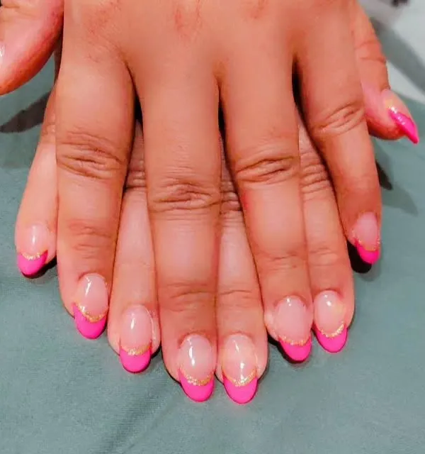 Here is a fun, modern take on the French manicure. I used a bright pink for the tips on these almond nails and added a thin gold glitter line to separate it from the natural base.