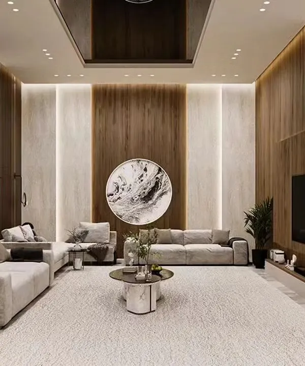 This expansive living room showcases our ability to handle large-scale projects, featuring a neutral color palette, wood and marble paneling, and a layout designed for both grand entertaining and quiet family evenings.