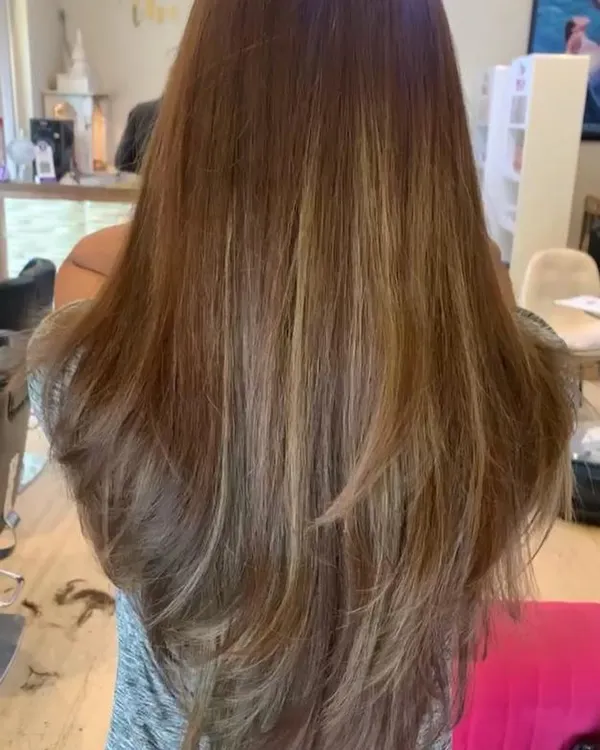 A classic long-layered haircut. This technique adds movement and volume to long hair, removing weight without sacrificing length, and is perfect for a soft, feathered look.