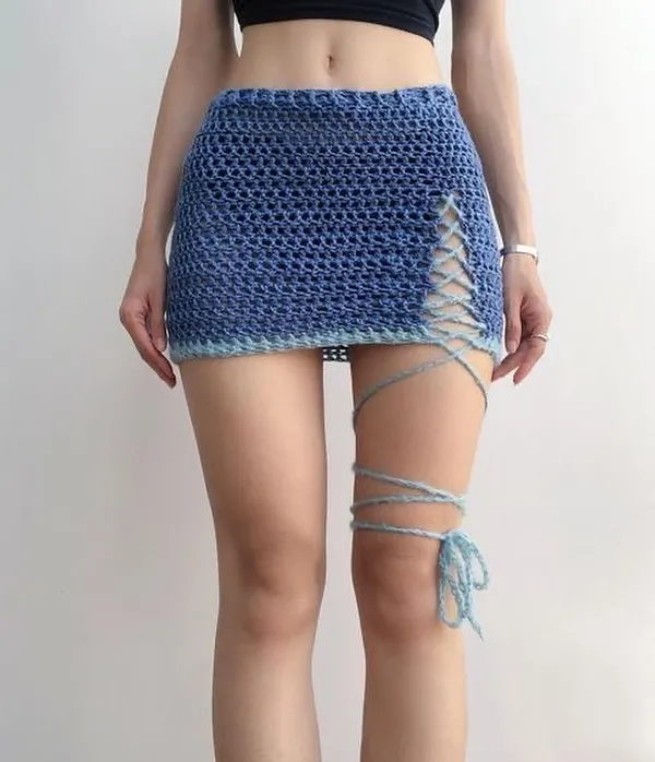 This is my favorite coquette-style mini skirt. I designed it with a mesh stitch and a side slit that has a cute lace-up detail and a long tie you can wrap around your leg. It’s perfect for a beach day or a summer festival look.