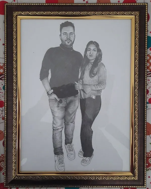 A custom A3-sized pencil sketch I did for a couple. Realistic pencil portraits are a popular choice for personal gifts, capturing a special memory in a timeless piece of art. This one is framed and ready to be displayed.