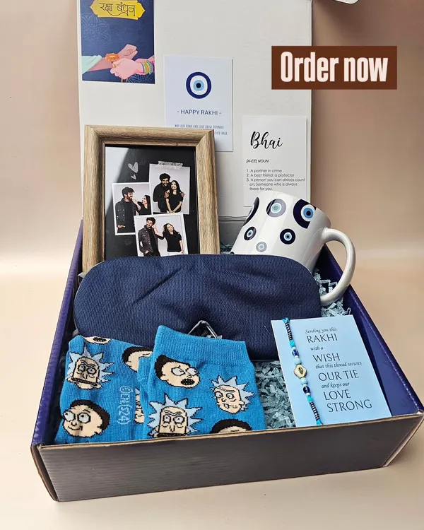 For the brother who deserves more than just sweets. This evil-eye themed hamper includes a personalized photo frame, a quirky mug, fun socks, and a comfy eye mask, all packed in a stylish gift box.