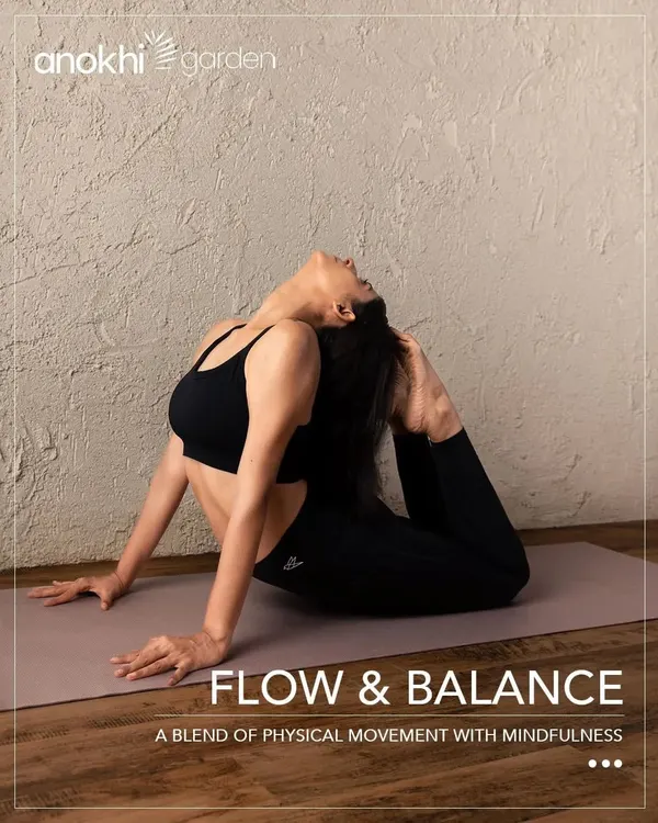 A student gracefully holds a heart-opening backbend in our Flow & Balance class. This Hatha Vinyasa practice is designed to blend physical movement with mindfulness, creating a powerful connection between body and breath.