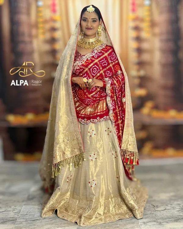 A full-length view of the quintessential Marwadi bride, showcasing the magnificent lehenga and my signature dupatta draping. The makeup is designed to complement the grandeur of the entire ensemble.