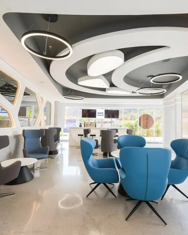 This wide shot of a modern commercial lounge for Architect Reza Kabul showcases my ability to capture complex designs and lighting. I focus on creating bright, inviting images that highlight the architectural details, like the unique ceiling structure and contemporary furniture arrangement.