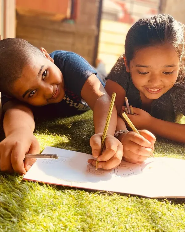 This is what it's all about! Two siblings working together on a page in my Doodle Book.