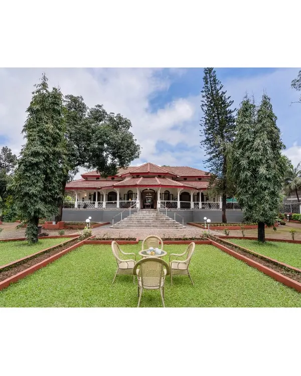 A wide view of the fully restored century-old building in Lonavala, set within its manicured landscape. The project balanced preservation of the original Indo-Saracenic character with necessary structural and functional upgrades.