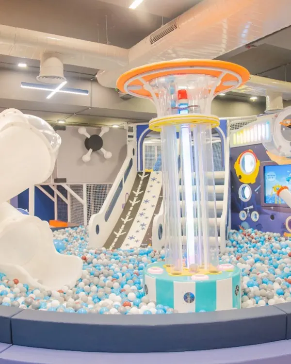 A wide view of our main play area, centered around the massive ball pit. This space is designed for ultimate fun with slides, climbers, and interactive games all in one place.