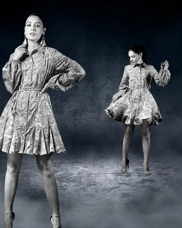A creative, composite image showing two versions of a model in a patterned dress against a moody, textured background. This artistic approach creates a dynamic and visually interesting fashion photograph.