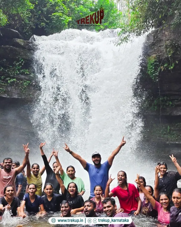 The pure joy of cooling off under a waterfall with new friends. This is what our trips are all about: adventure, laughter, and unforgettable moments.
