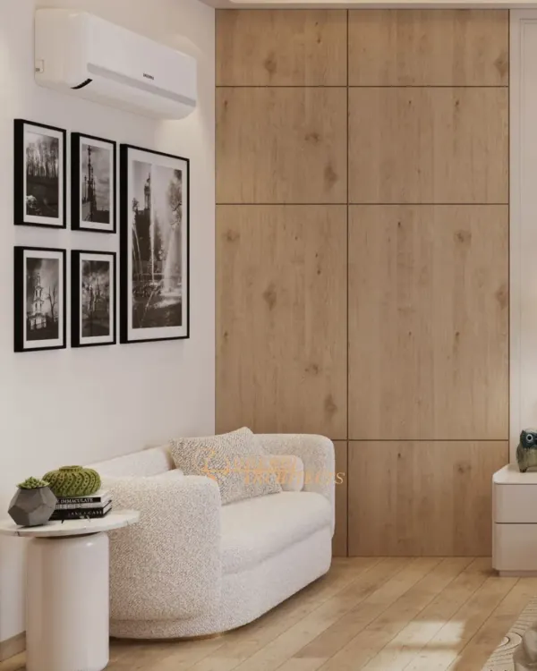 A cozy reading nook within the bedroom, featuring a plush bouclé sofa against a warm wood-paneled wall. This corner is a perfect example of how we create functional, intimate zones within a larger space.