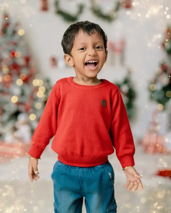 The pure, uncontainable joy of the holiday season. This little boy's explosive laughter perfectly captures the magic of Christmas.