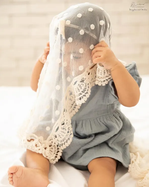 A playful game of peek-a-boo during a sitter session. I love capturing these spontaneous, joyful moments as babies explore different textures and props.
