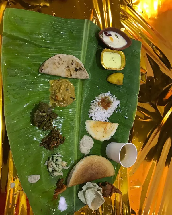 This is the heart of my service, the traditional South Indian Ele Oota. I serve a complete, authentic meal on a fresh banana leaf, featuring a variety of dishes like curries, rice, roti, and sweets. It’s a feast for the eyes and the soul, perfect for weddings and traditional functions.