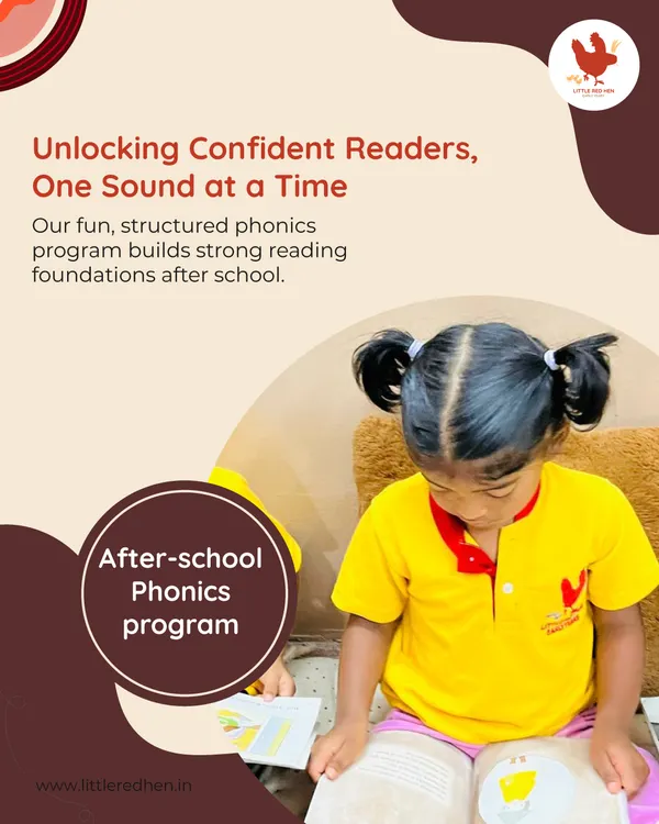 A young girl in pigtails concentrates on a book, showcasing the focus our fun, structured phonics program inspires. We build strong reading foundations one sound at a time.
