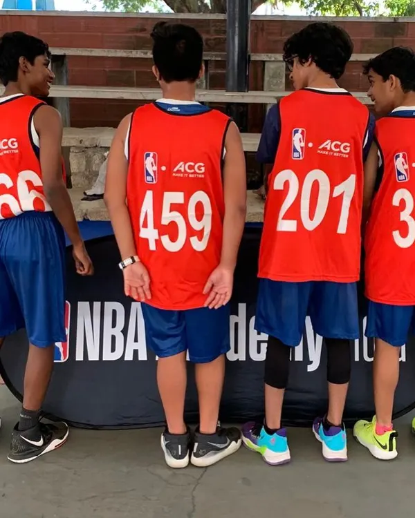 Geared up and ready to compete. Our players stand together before taking the court at the Jr. NBA Academy tryouts in Delhi. These events are a crucial step for young athletes looking to gain exposure and experience.