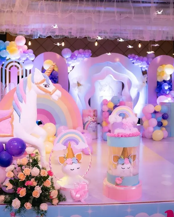 A close-up of the custom-fabricated props for our unicorn-themed party. This life-sized unicorn and the cute unicorn return gift stands were all made in our workshop.
